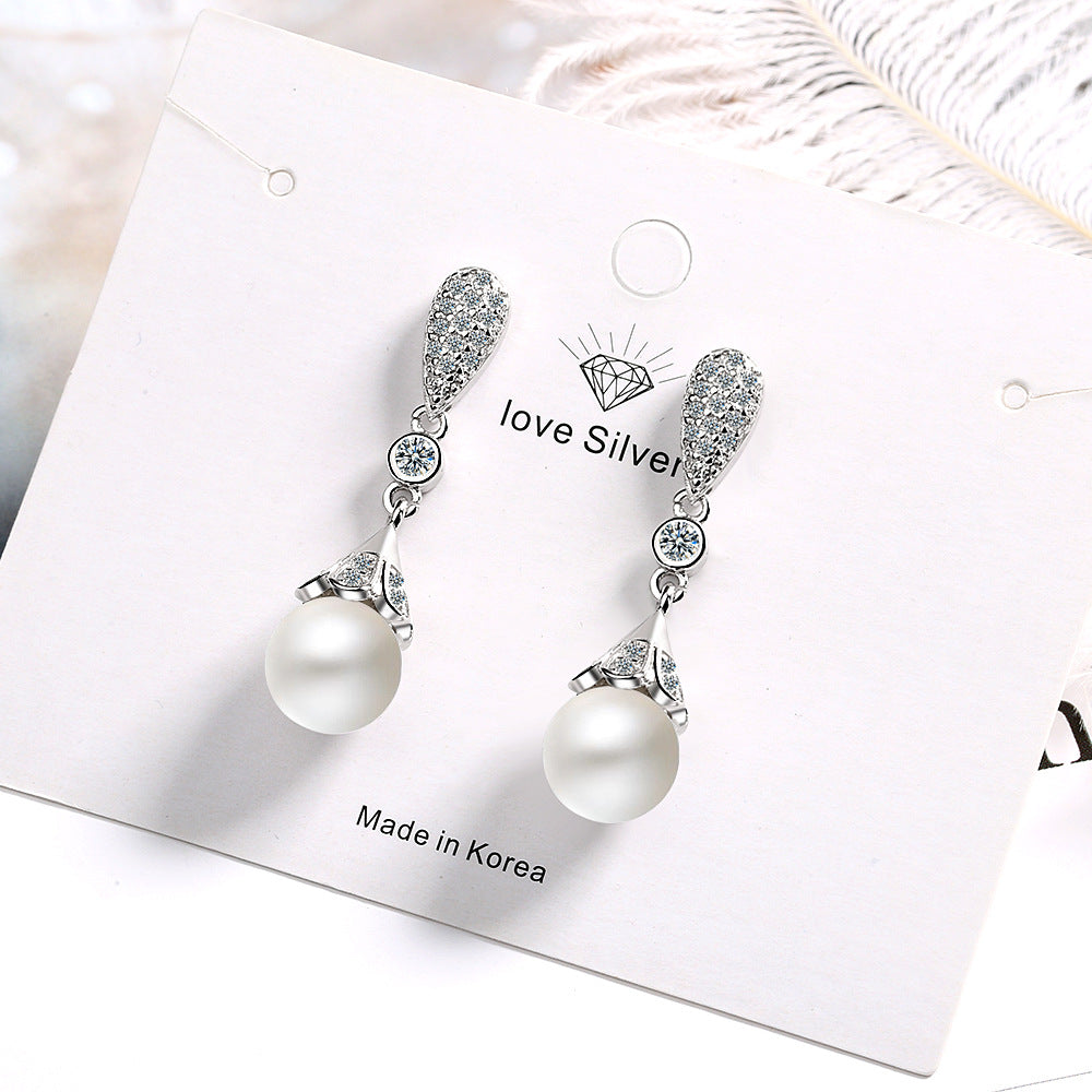 Heart-shaped long pearl earrings